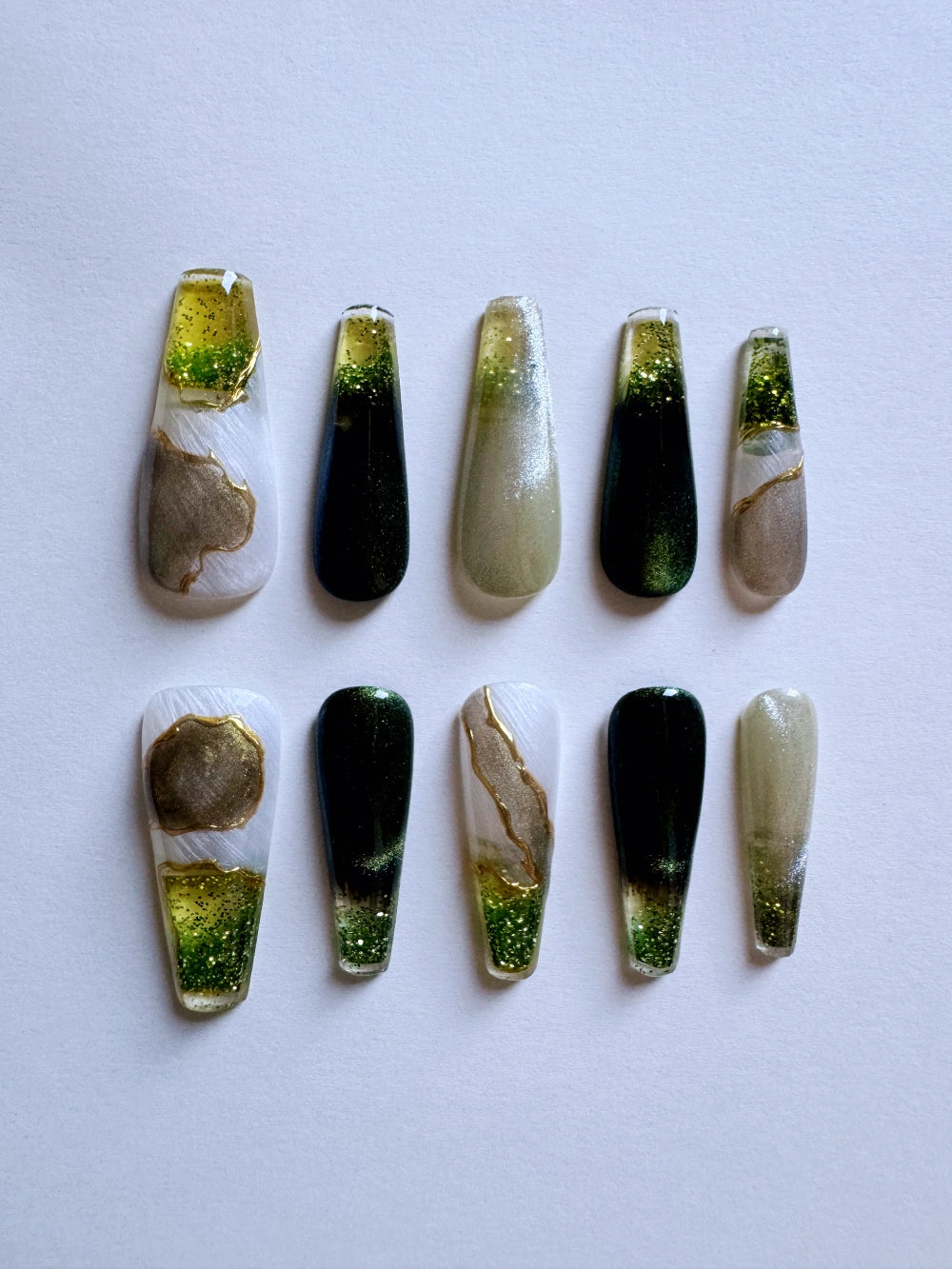 Emerald Pool Hand Drawn Elaborate Satin Gold Outline Emerald Cat Eye Flowing Sand Nail Art